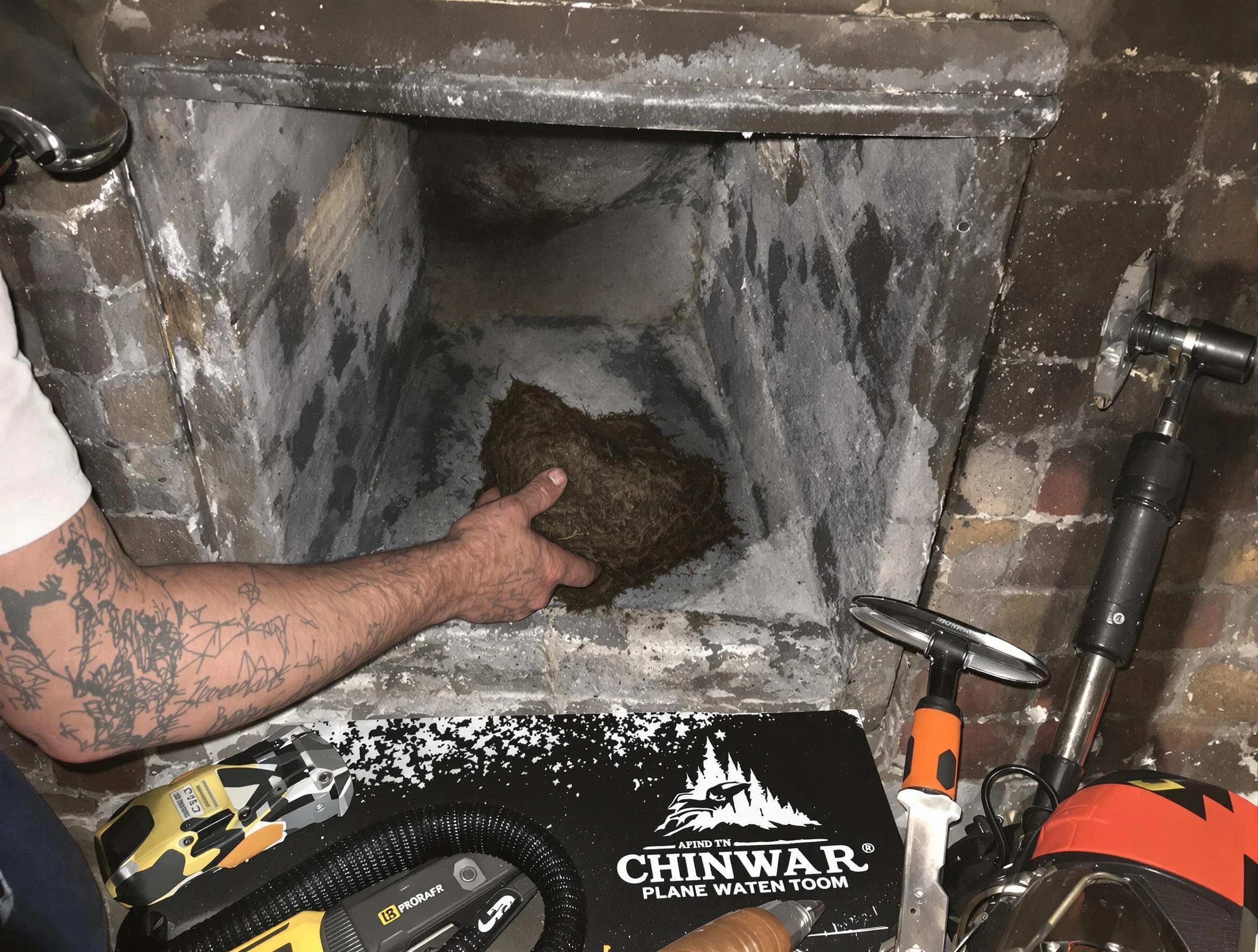 Pell City Chimney Sweep safely removing debris and screening chimney in Pell City, AL